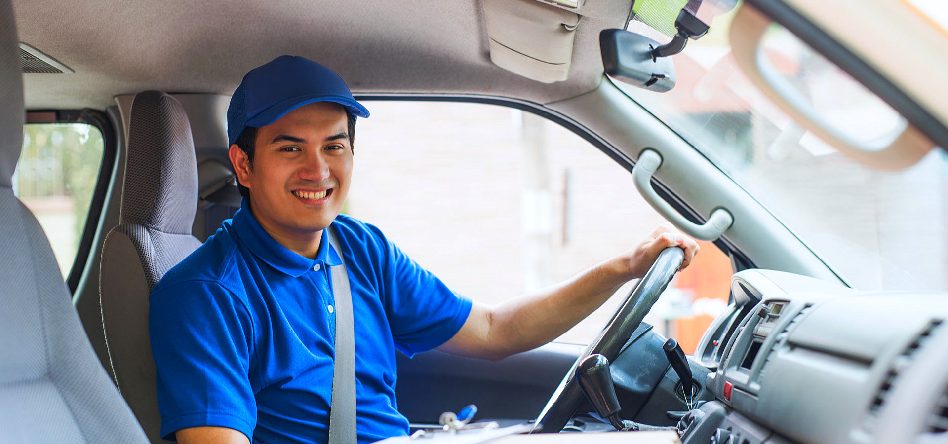 male driver smiling